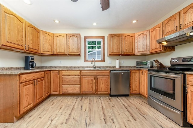 40 Walter Rd, Pine Twp Mer, PA 16127 - kitchen with appliances with stainless steel finishes, a sink, under cabinet range hood, light wood finished floors, and recessed lighting
