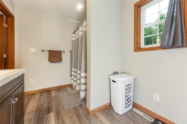 40 Walter Rd, Pine Twp Mer, PA 16127 - full bathroom with wood finished floors, vanity, baseboards, and a shower with shower curtain