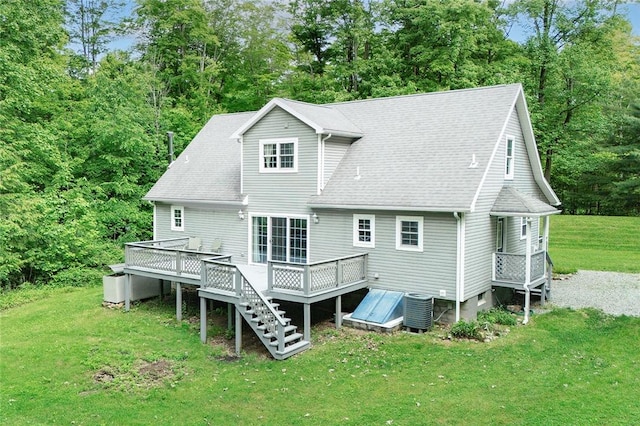 40 Walter Rd, Pine Twp Mer, PA 16127 - rear view of property featuring a deck, central AC, a lawn, roof with shingles, and view of scattered trees