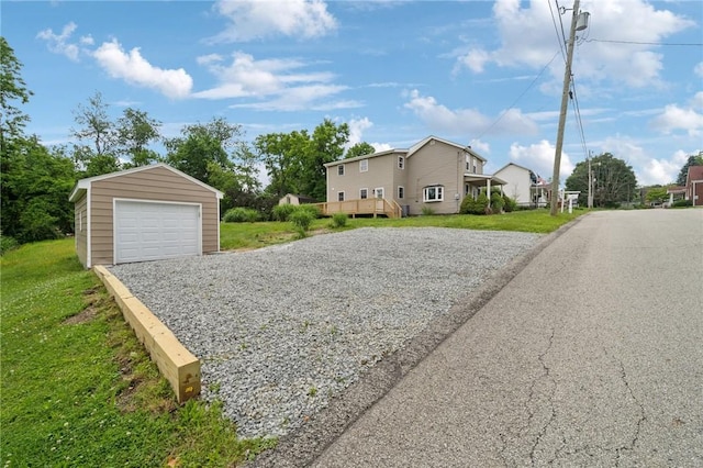 1004 Government Rd, Penn Twp Wml, PA 15642 - view of home's exterior with an outbuilding, a garage, gravel driveway, and a yard
