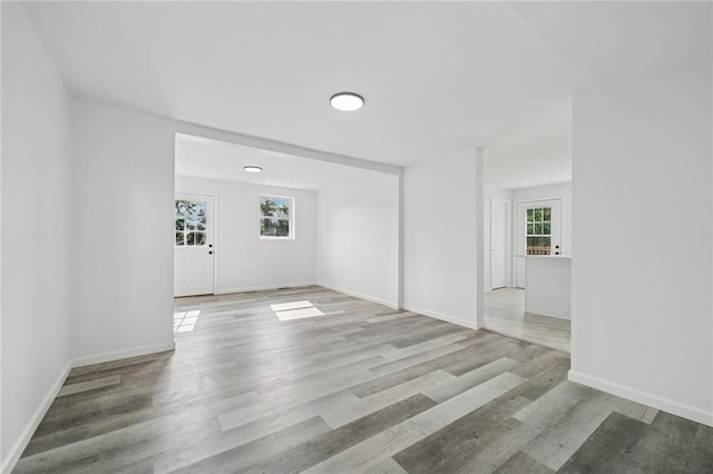 1004 Government Rd, Penn Twp Wml, PA 15642 - empty room featuring healthy amount of natural light, wood finished floors, and baseboards