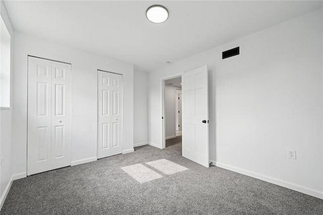 1004 Government Rd, Penn Twp Wml, PA 15642 - unfurnished bedroom with multiple closets, carpet, and baseboards