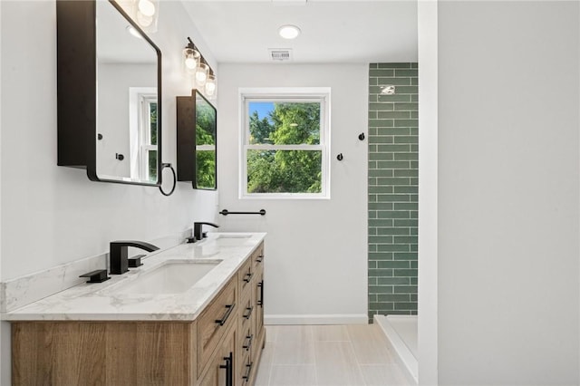 1004 Government Rd, Penn Twp Wml, PA 15642 - bathroom with double vanity, tiled shower, baseboards, and tile patterned flooring