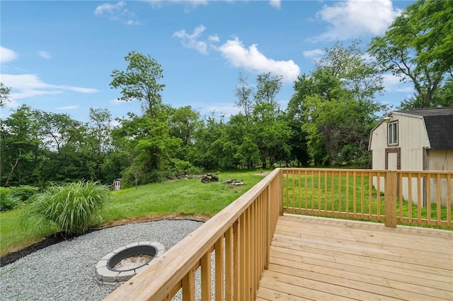 1004 Government Rd, Penn Twp Wml, PA 15642 - deck featuring a lawn, an outdoor fire pit, and view of scattered trees