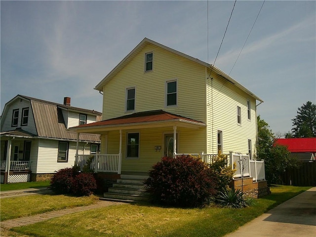 152 E Garrett St, Somerset Twp, PA 15501 - view of front facade featuring a porch and a front yard