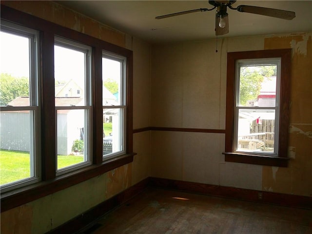 152 E Garrett St, Somerset Twp, PA 15501 - empty room with wood finished floors, a ceiling fan, and baseboards