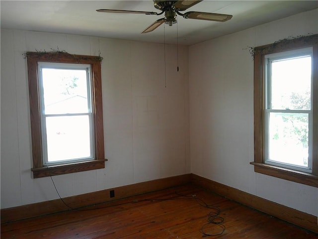 152 E Garrett St, Somerset Twp, PA 15501 - empty room featuring hardwood / wood-style flooring, healthy amount of natural light, and a ceiling fan