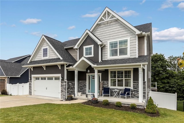 582 Forest Oaks Trl, North Huntingdon, PA 15642 - craftsman house featuring a porch, board and batten siding, driveway, stone siding, and roof with shingles