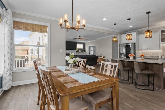 582 Forest Oaks Trl, North Huntingdon, PA 15642 - dining room with wood finished floors, baseboards, ceiling fan, recessed lighting, and a chandelier