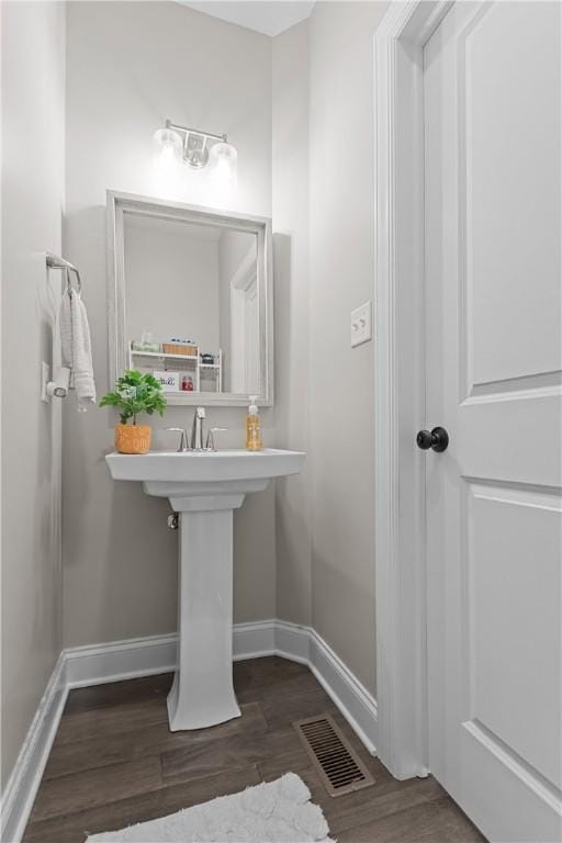 582 Forest Oaks Trl, North Huntingdon, PA 15642 - bathroom featuring wood finished floors and baseboards