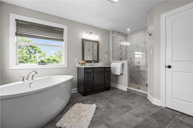582 Forest Oaks Trl, North Huntingdon, PA 15642 - full bathroom with baseboards, vanity, a shower stall, and a freestanding bath