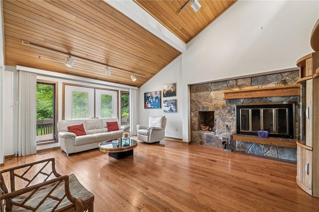 436 Lakewood Rd, Hempfield Twp Wml, PA 15601 - living room featuring wooden ceiling, wood finished floors, a stone fireplace, track lighting, and high vaulted ceiling