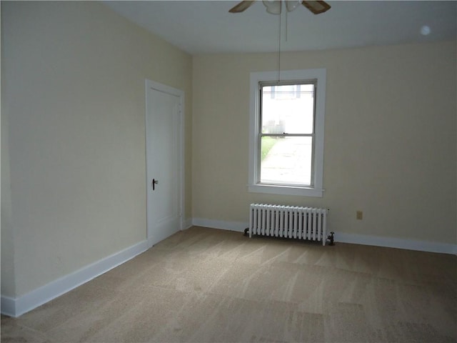 30 Coulter St, Crafton, PA 15205 - unfurnished room with radiator heating unit, ceiling fan, light carpet, and baseboards