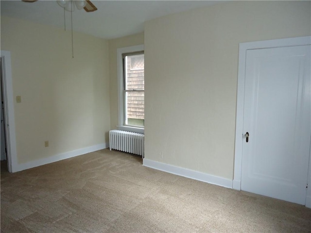 30 Coulter St, Crafton, PA 15205 - empty room featuring radiator heating unit, carpet, ceiling fan, and baseboards