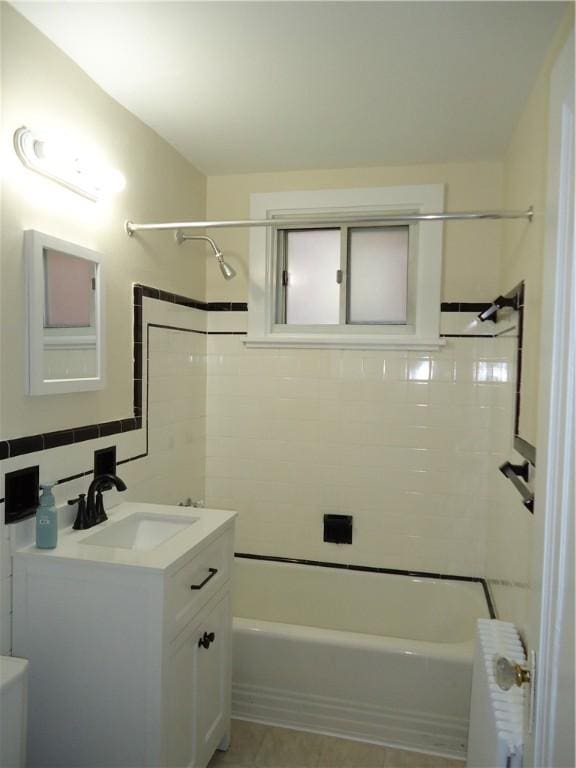 30 Coulter St, Crafton, PA 15205 - bathroom featuring vanity, radiator, shower / bath combination, and tile walls