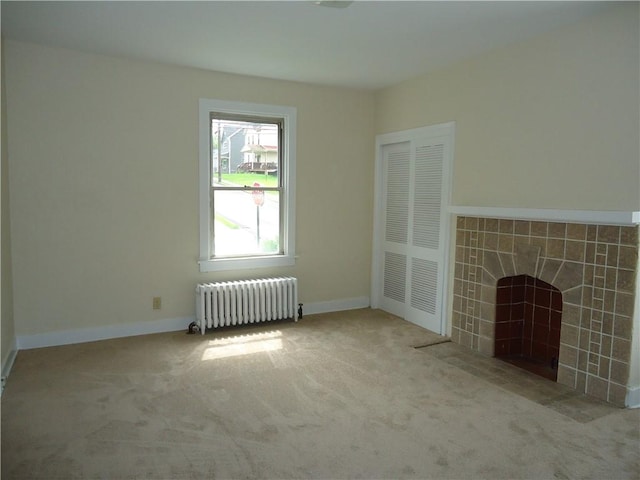 30 Coulter St, Crafton, PA 15205 - unfurnished living room with radiator heating unit, a tile fireplace, carpet, and baseboards
