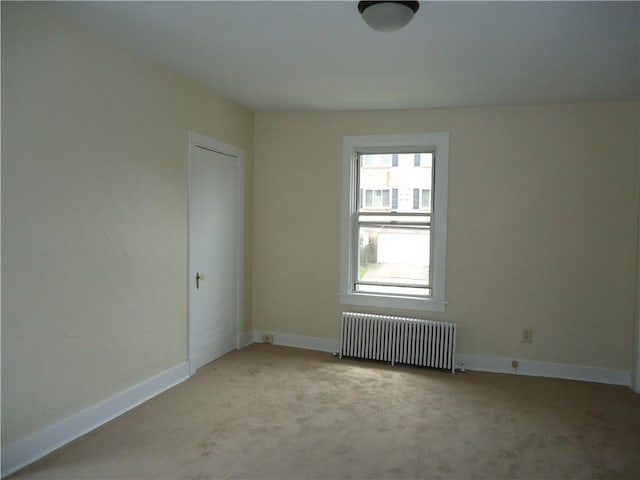 30 Coulter St, Crafton, PA 15205 - unfurnished room featuring radiator, light carpet, and baseboards