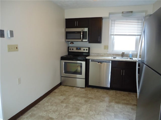 30 Coulter St, Crafton, PA 15205 - kitchen featuring stainless steel appliances, a sink, light countertops, and baseboards