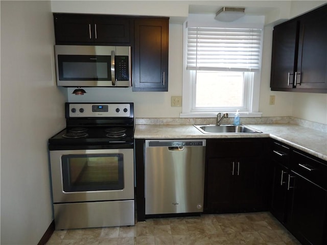 30 Coulter St, Crafton, PA 15205 - kitchen with appliances with stainless steel finishes, a sink, and light countertops