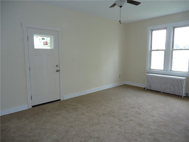 30 Coulter St, Crafton, PA 15205 - entrance foyer with radiator, a ceiling fan, carpet, and baseboards