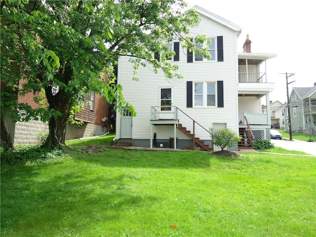 30 Coulter St, Crafton, PA 15205 - back of property with a lawn, stairway, a chimney, and a balcony