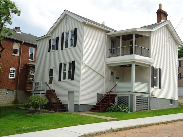 30 Coulter St, Crafton, PA 15205 - view of front of home featuring a balcony, stairway, and a front yard