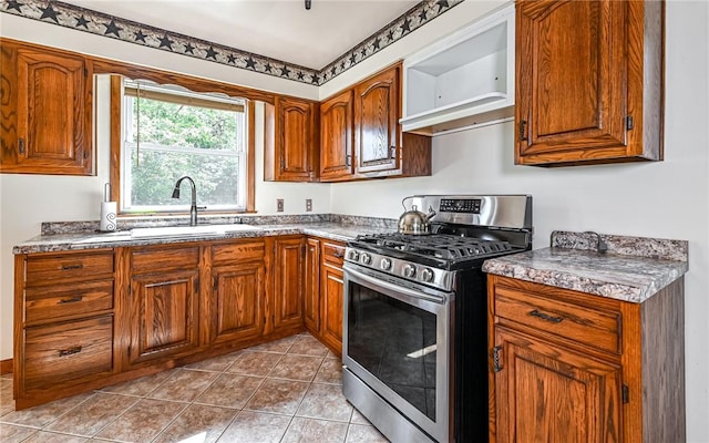 2760 Ridge Road Ext, Economy, PA 15005 - kitchen with gas range, a sink, brown cabinets, and tile patterned floors