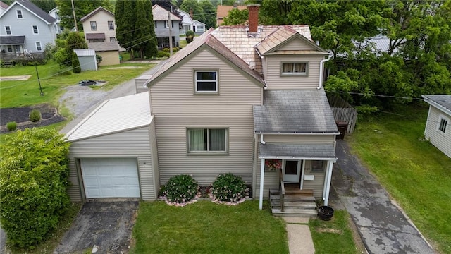 409 Summit St, Grove City Boro, PA 16127 - view of front facade with a chimney, driveway, and a front yard