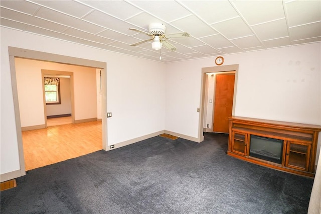 409 Summit St, Grove City Boro, PA 16127 - unfurnished living room featuring dark carpet and a ceiling fan