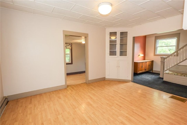 409 Summit St, Grove City Boro, PA 16127 - spare room featuring wood finished floors, stairs, and baseboard heating