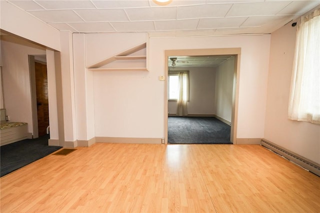 409 Summit St, Grove City Boro, PA 16127 - spare room featuring wood finished floors and a baseboard radiator