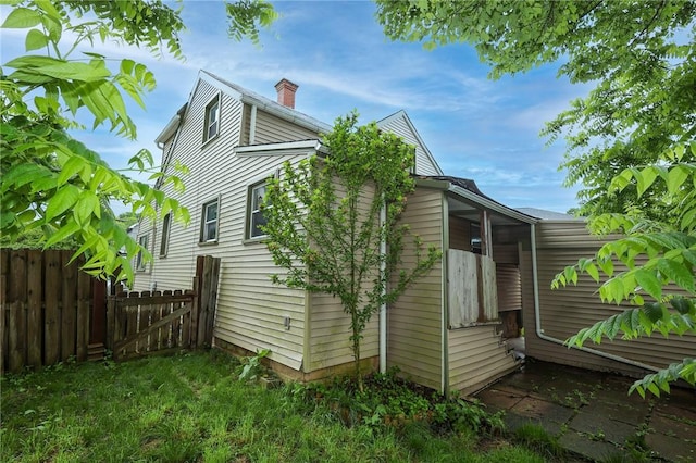 409 Summit St, Grove City Boro, PA 16127 - view of side of property featuring a chimney