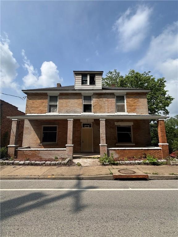 189 Beaver St, Leetsdale, PA 15056 - traditional style home featuring brick siding and covered porch