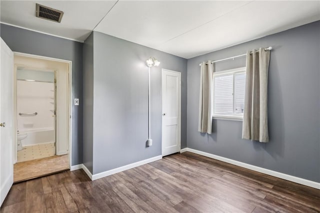 1913 Glen Rd, Pa, PA 15001 - unfurnished bedroom with dark wood finished floors and baseboards