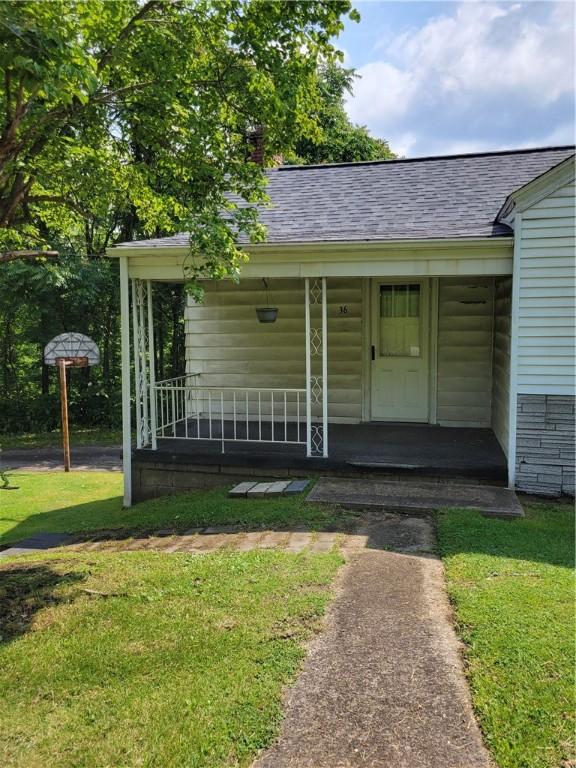 36 Daisytown Rd, Centerville, PA 15427 - entrance to property with a shingled roof, covered porch, and a yard