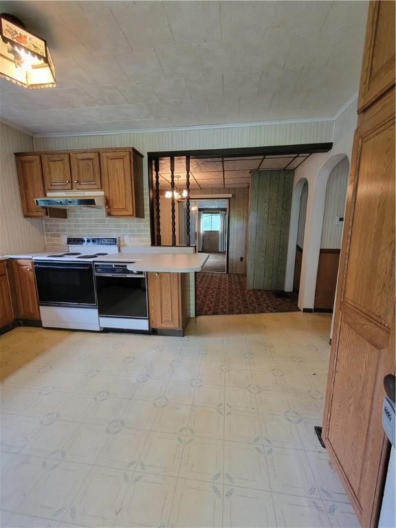 36 Daisytown Rd, Centerville, PA 15427 - kitchen featuring electric range, dishwasher, under cabinet range hood, brown cabinetry, and light flooring