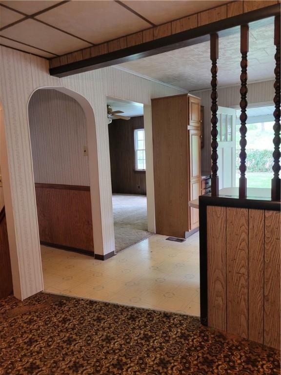 36 Daisytown Rd, Centerville, PA 15427 - spare room with light flooring, ceiling fan, wooden walls, and arched walkways