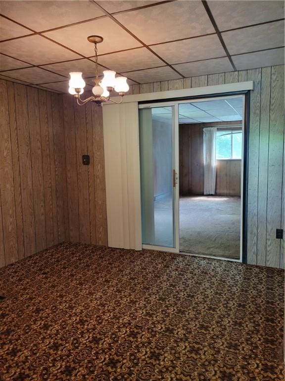 36 Daisytown Rd, Centerville, PA 15427 - unfurnished room featuring wood walls and a chandelier