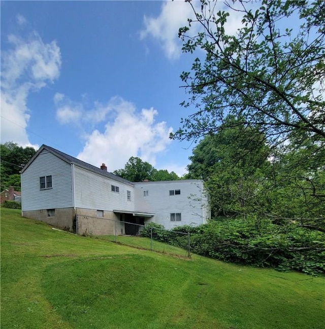 36 Daisytown Rd, Centerville, PA 15427 - rear view of house with a lawn and a chimney