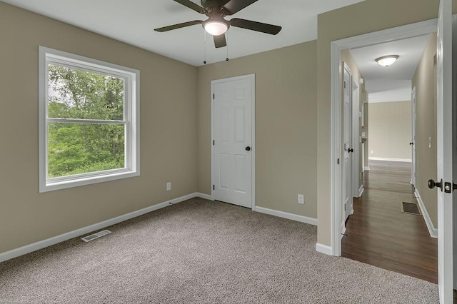 683 Mercer New Wilmington Rd, E Lackawannock Twp, PA 16137 - unfurnished bedroom featuring carpet floors, multiple windows, baseboards, and a ceiling fan