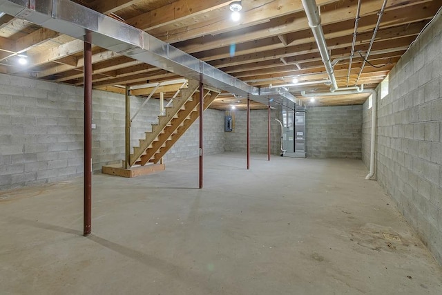 683 Mercer New Wilmington Rd, E Lackawannock Twp, PA 16137 - unfinished below grade area featuring heating unit, stairs, and electric panel
