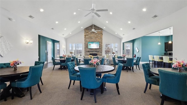 387 Gleneagles Dr, Center Twp But, PA 16001 - carpeted dining space with a ceiling fan, a stone fireplace, high vaulted ceiling, and recessed lighting