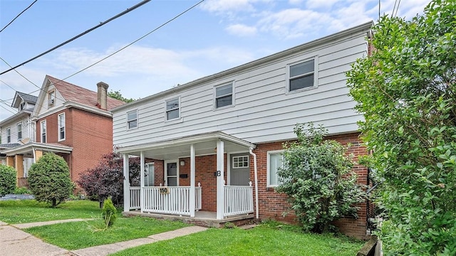 150 Hawthorne, West View, PA 15229 - view of property with covered porch, brick siding, and a front lawn