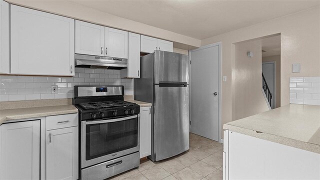 150 Hawthorne, West View, PA 15229 - kitchen featuring stainless steel appliances, under cabinet range hood, white cabinets, decorative backsplash, and light countertops