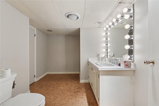 378 Stoneylonesome Rd, Cook Twp, PA 15687 - bathroom featuring toilet, vanity, baseboards, and speckled floor