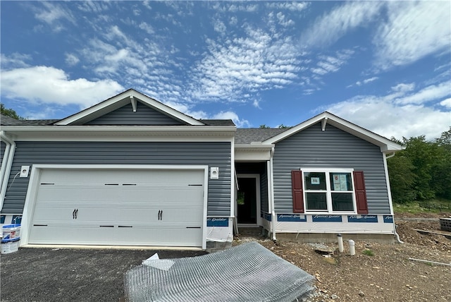 3045 Audrey Dr, Hempfield Twp, PA 15601 - view of front of property with a garage and asphalt driveway