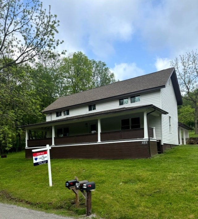155 Old E Butler Rd, Summit Twp But, PA 16002 - farmhouse-style home featuring a porch, a front lawn, and roof with shingles