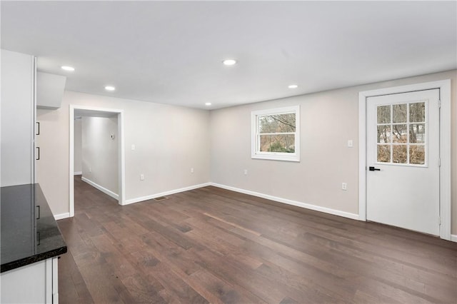 155 Old E Butler Rd, Summit Twp But, PA 16002 - unfurnished living room with dark wood-style floors, baseboards, and recessed lighting