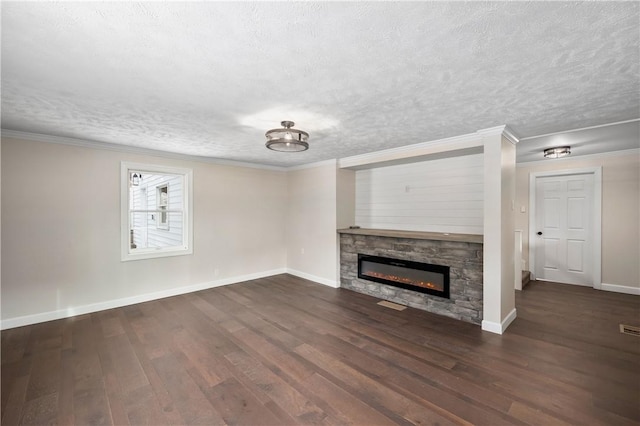 155 Old E Butler Rd, Summit Twp But, PA 16002 - unfurnished living room with a textured ceiling, wood finished floors, a stone fireplace, baseboards, and ornamental molding