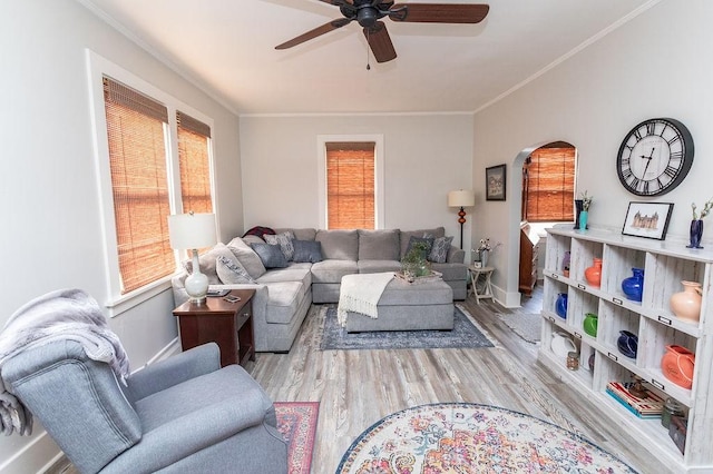 124 Clarendon Ave, South Union Twp, PA 15401 - living area with ceiling fan, arched walkways, wood finished floors, ornamental molding, and baseboards